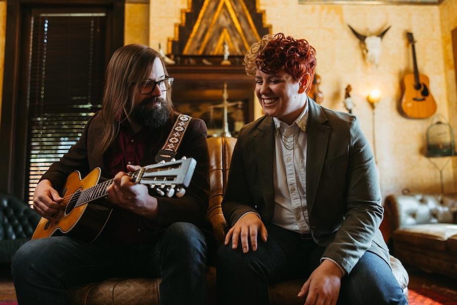 Dale and Cody are seen posing on strange furniture